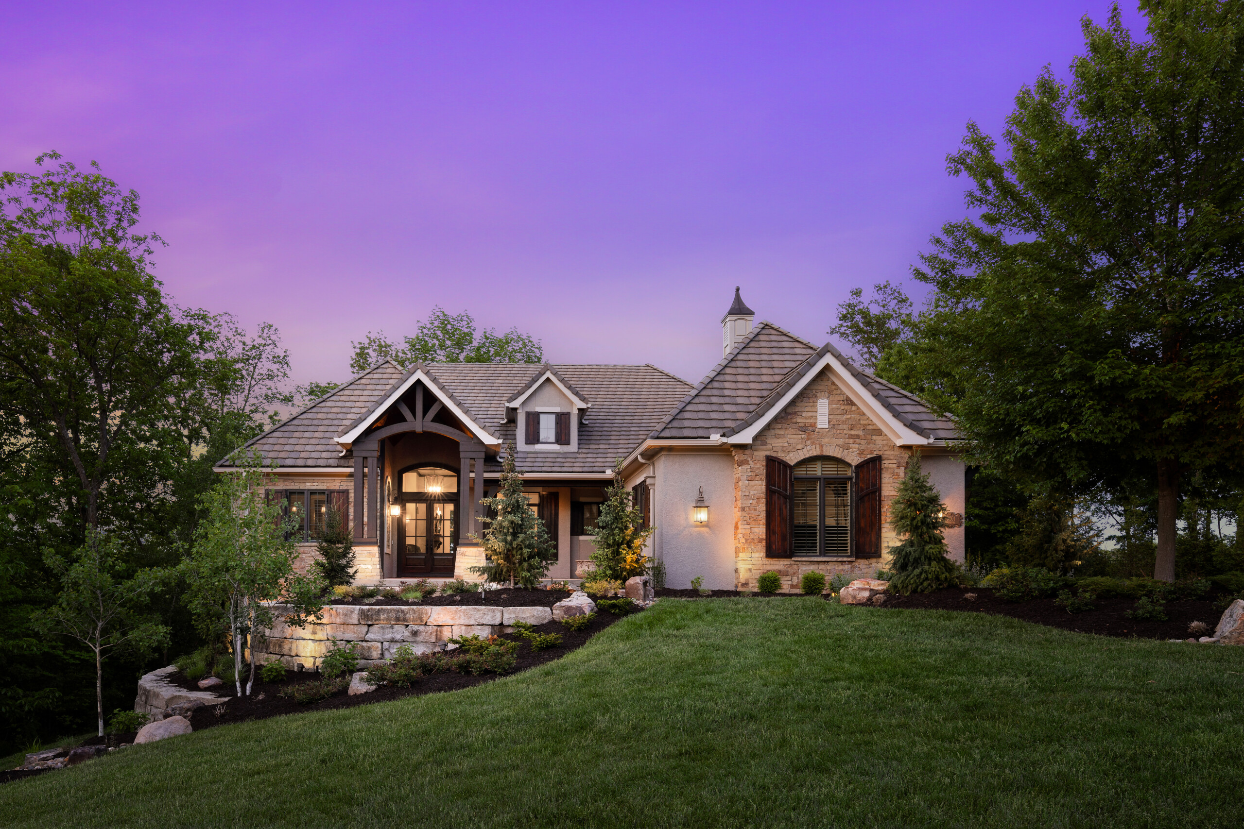 Gorgeous luxury home photo from Malfer & Associates showing how landscaping, and professional services can help you sell your home faster and for more money.