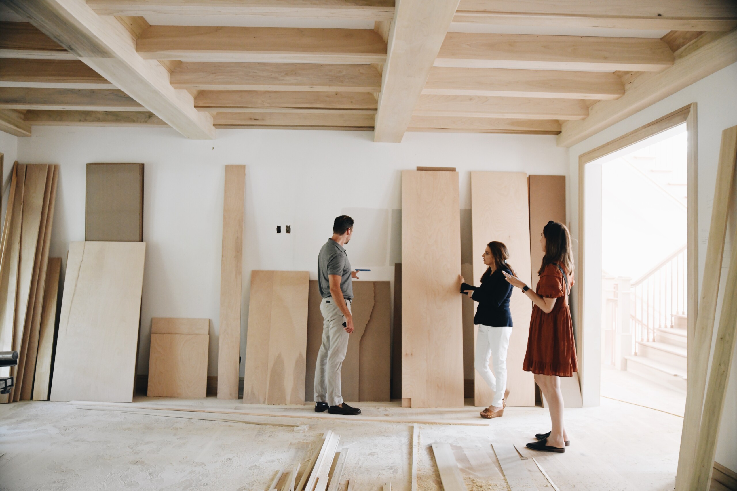 realtor showing clients a space under construction