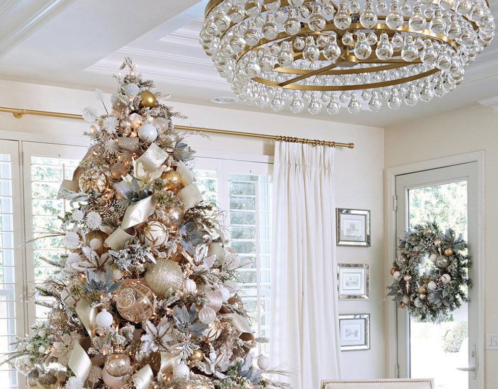 Gold and white Christmas tree in a living room
