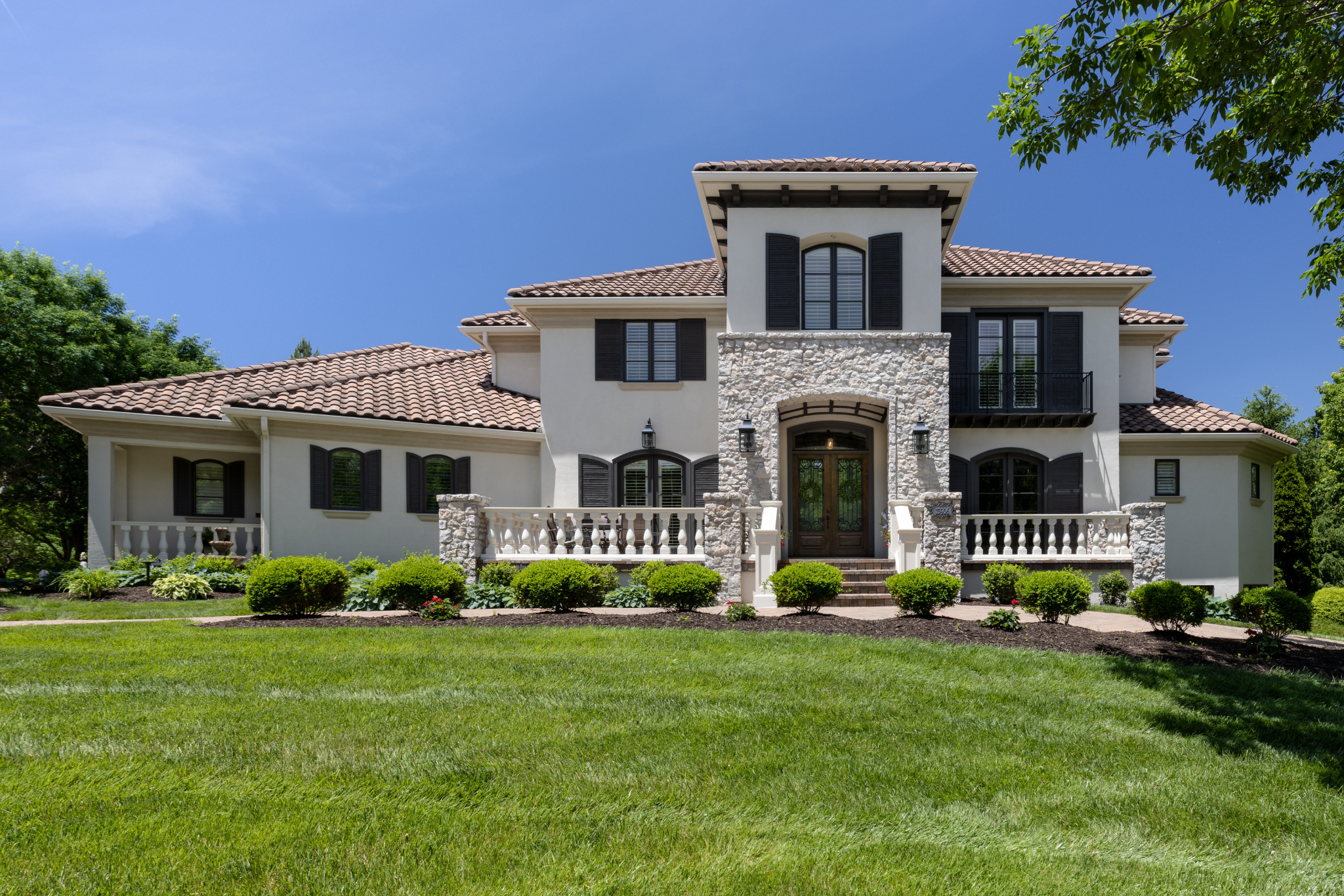 tuscan-style home sitting on a circle drive